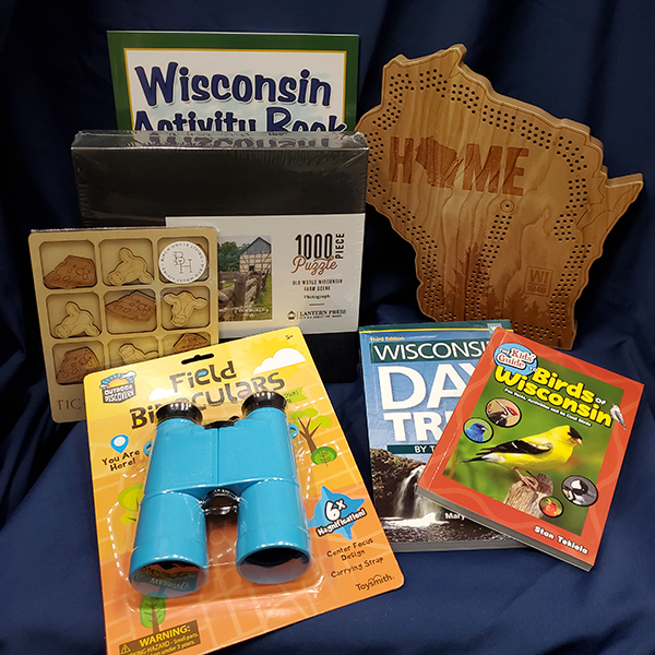 Basket including 1000 piece puzzle, field binoculars, Birds of Wisconsin and Wisconsin Day Trip Book, Wisconsin Activity Book